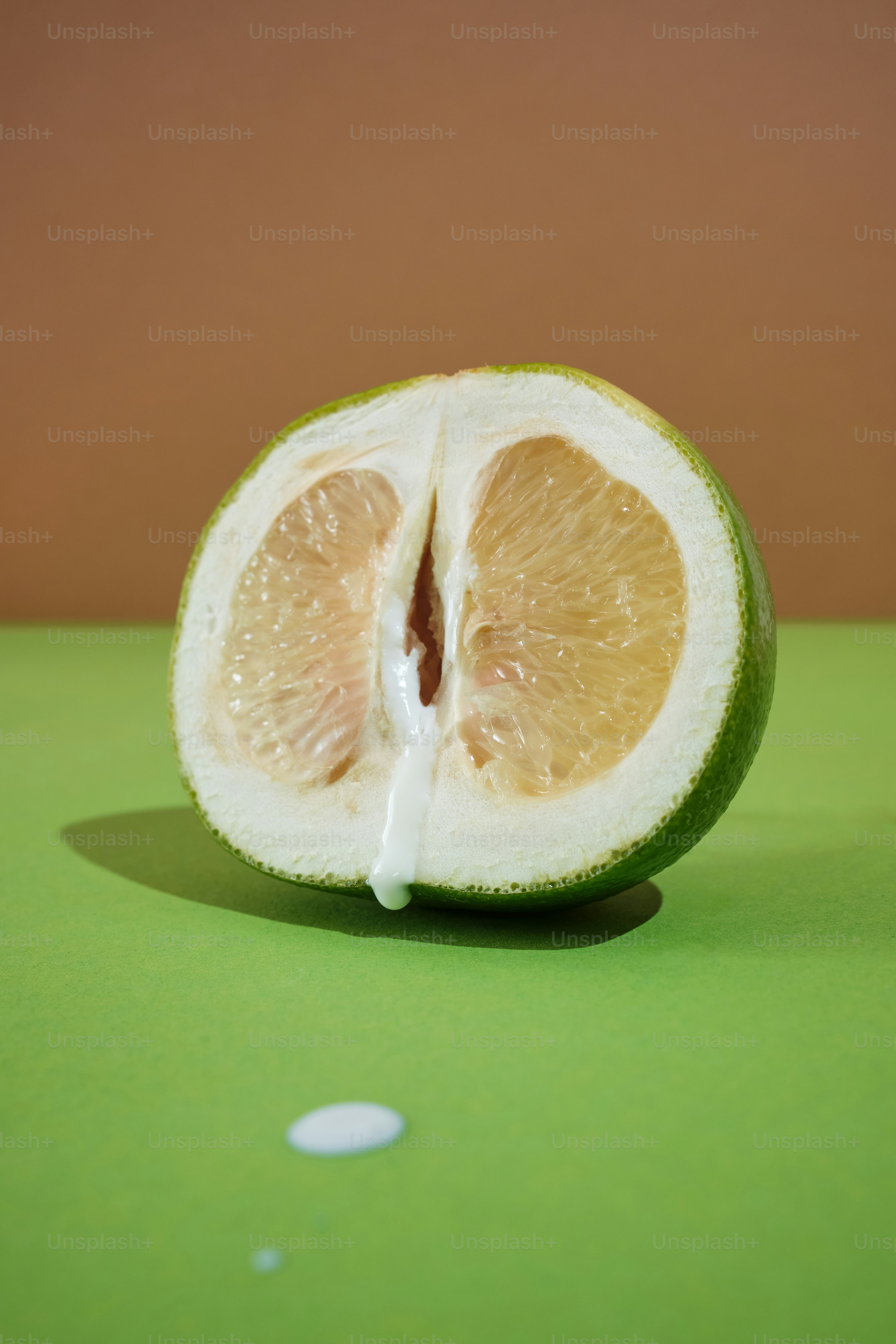 a cut of a citrus fruit resembling a woman's vulva