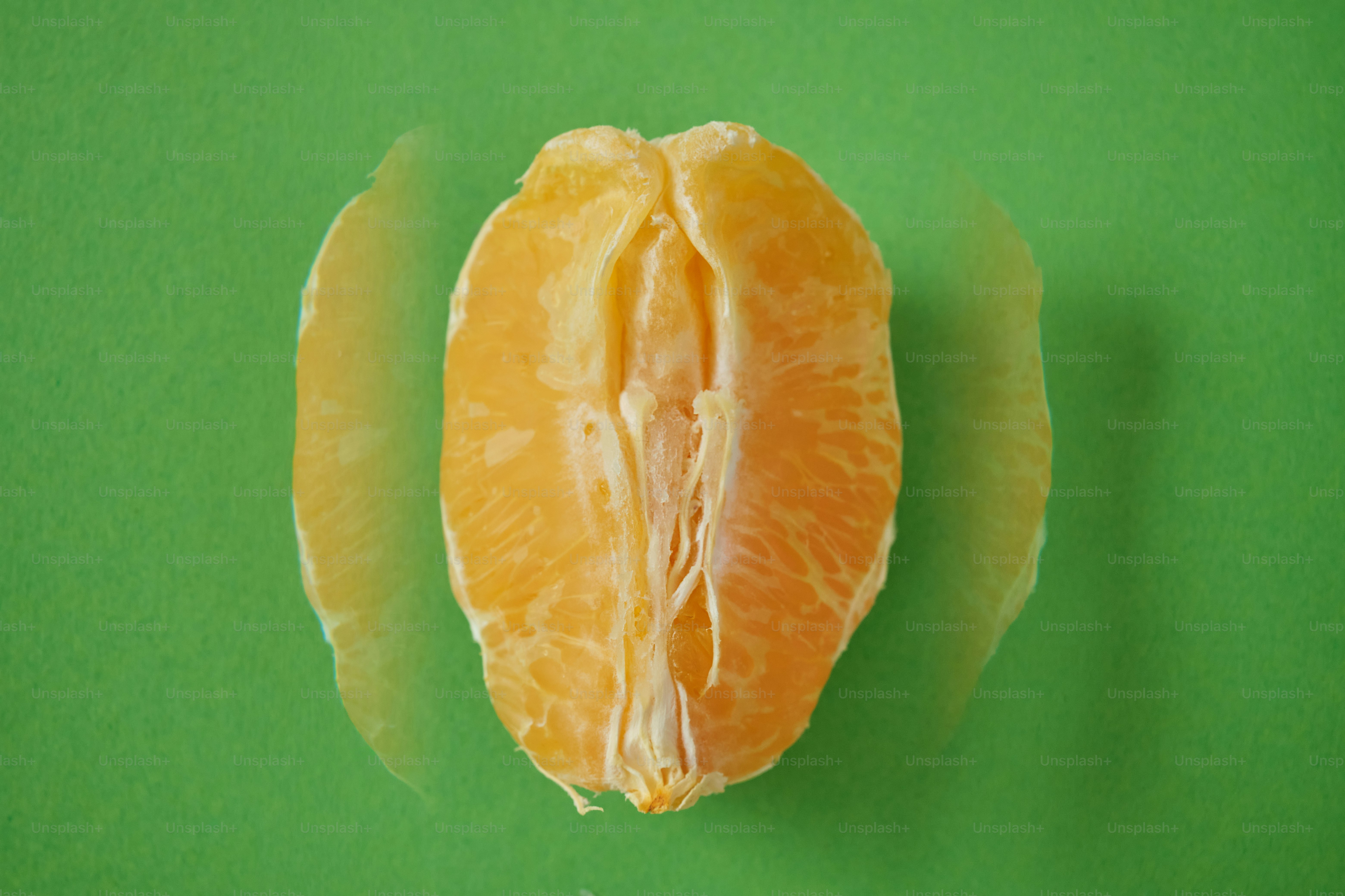 a cut of a citrus fruit resembling a woman's vulva