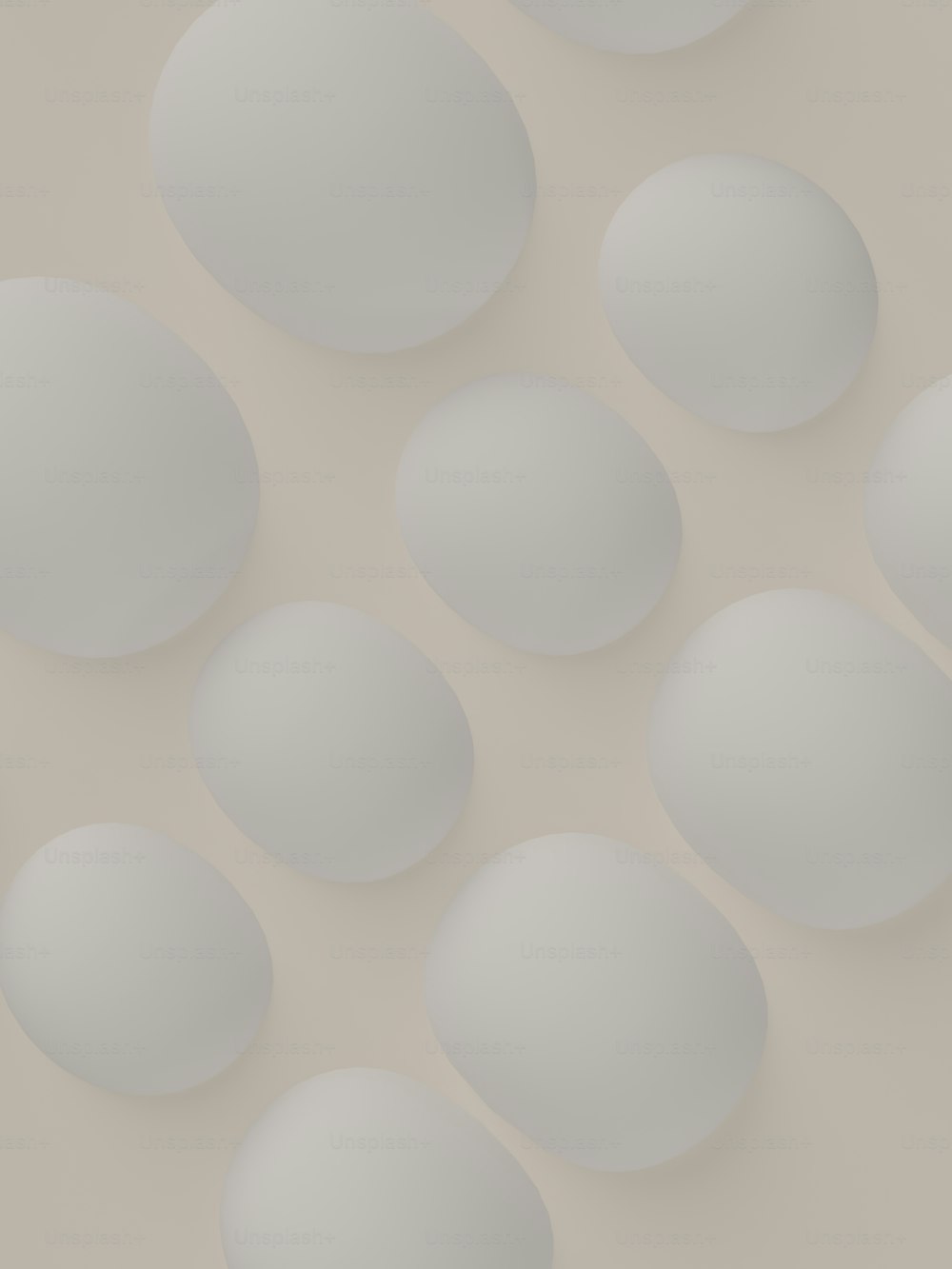 a bunch of white eggs sitting on top of a table