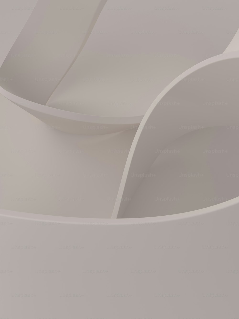 a close up of a white object with curved edges