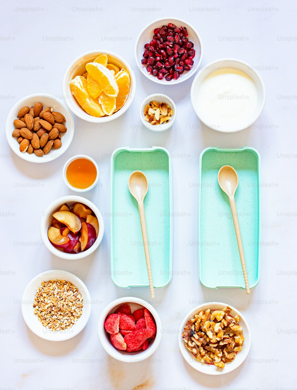 a table topped with bowls of fruit and nuts