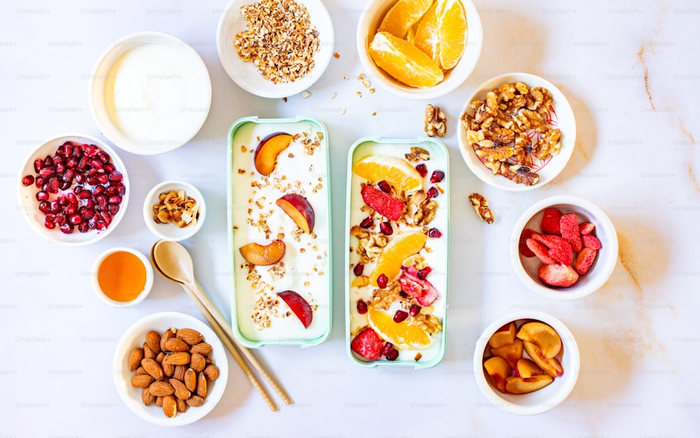 a table topped with bowls of fruit and nuts