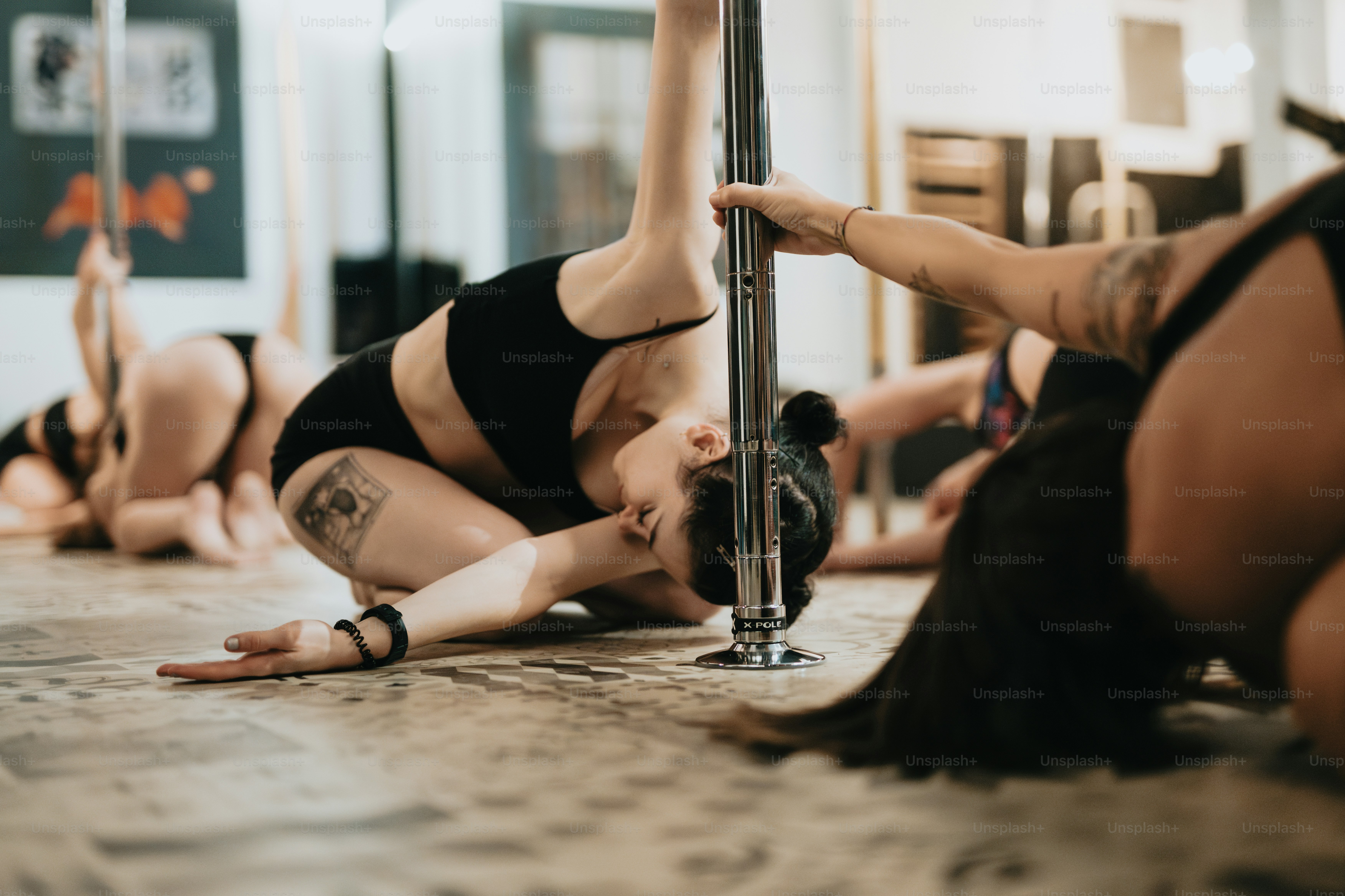 a group of women doing yoga on the floor