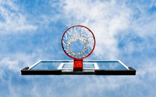 a basketball going through the rim of a basketball hoop