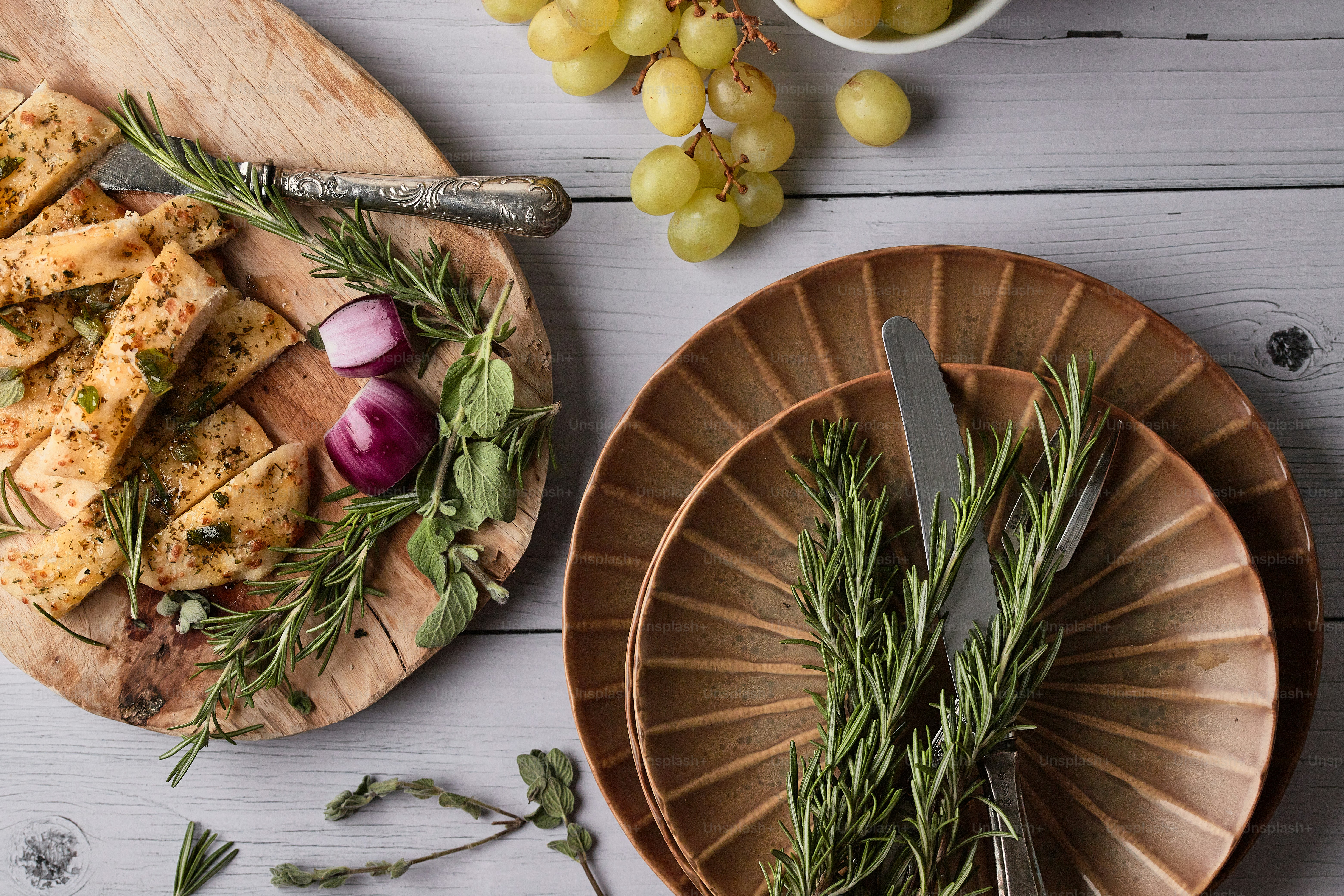 two plates of food on a white table