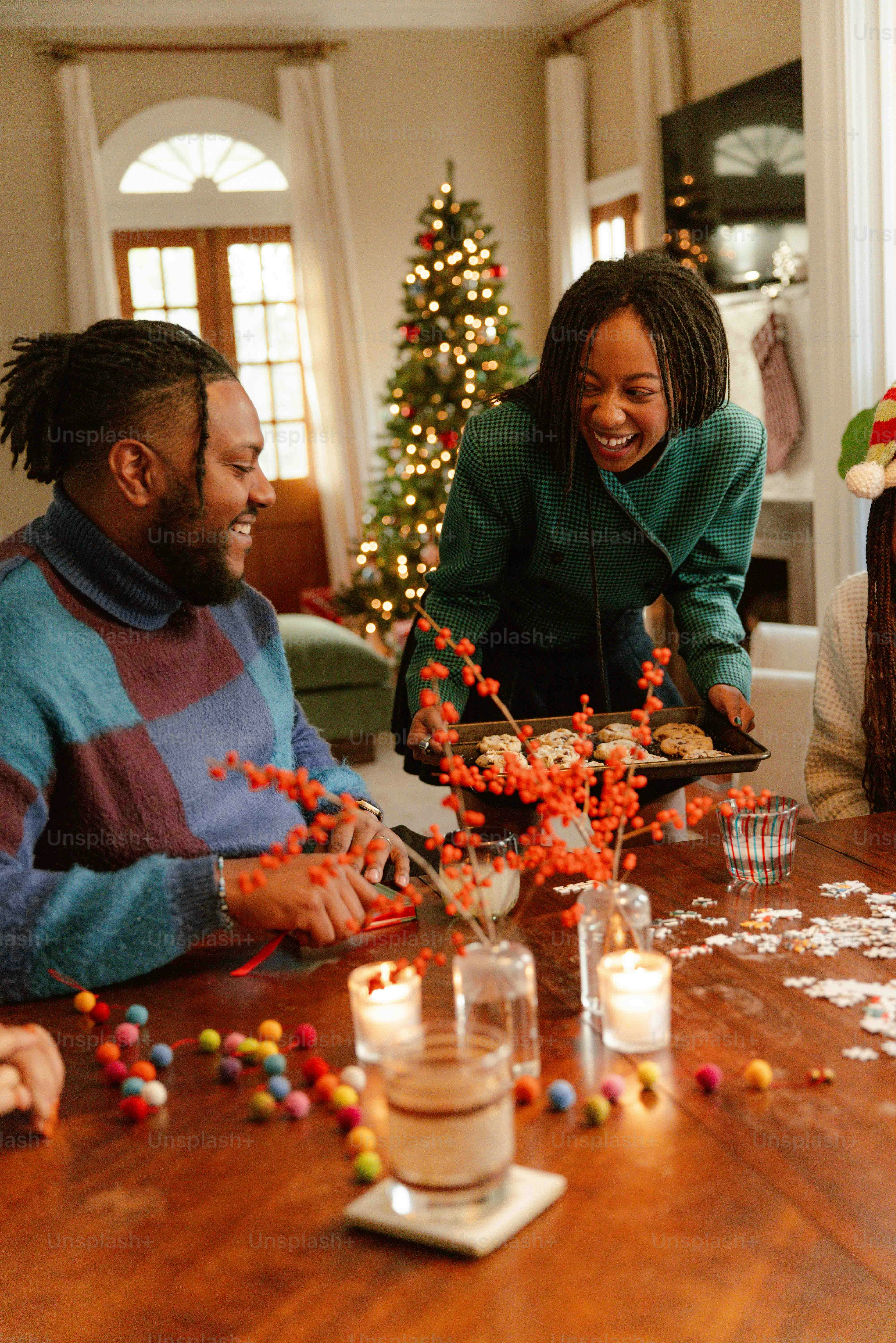 a group of people sitting around a wooden table