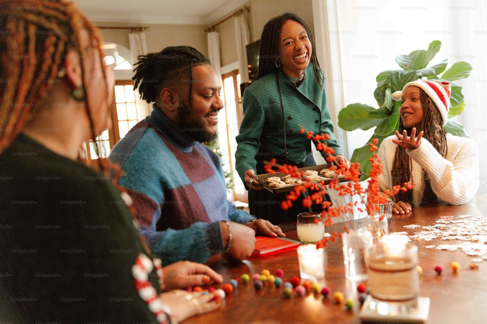 a group of people sitting around a wooden table