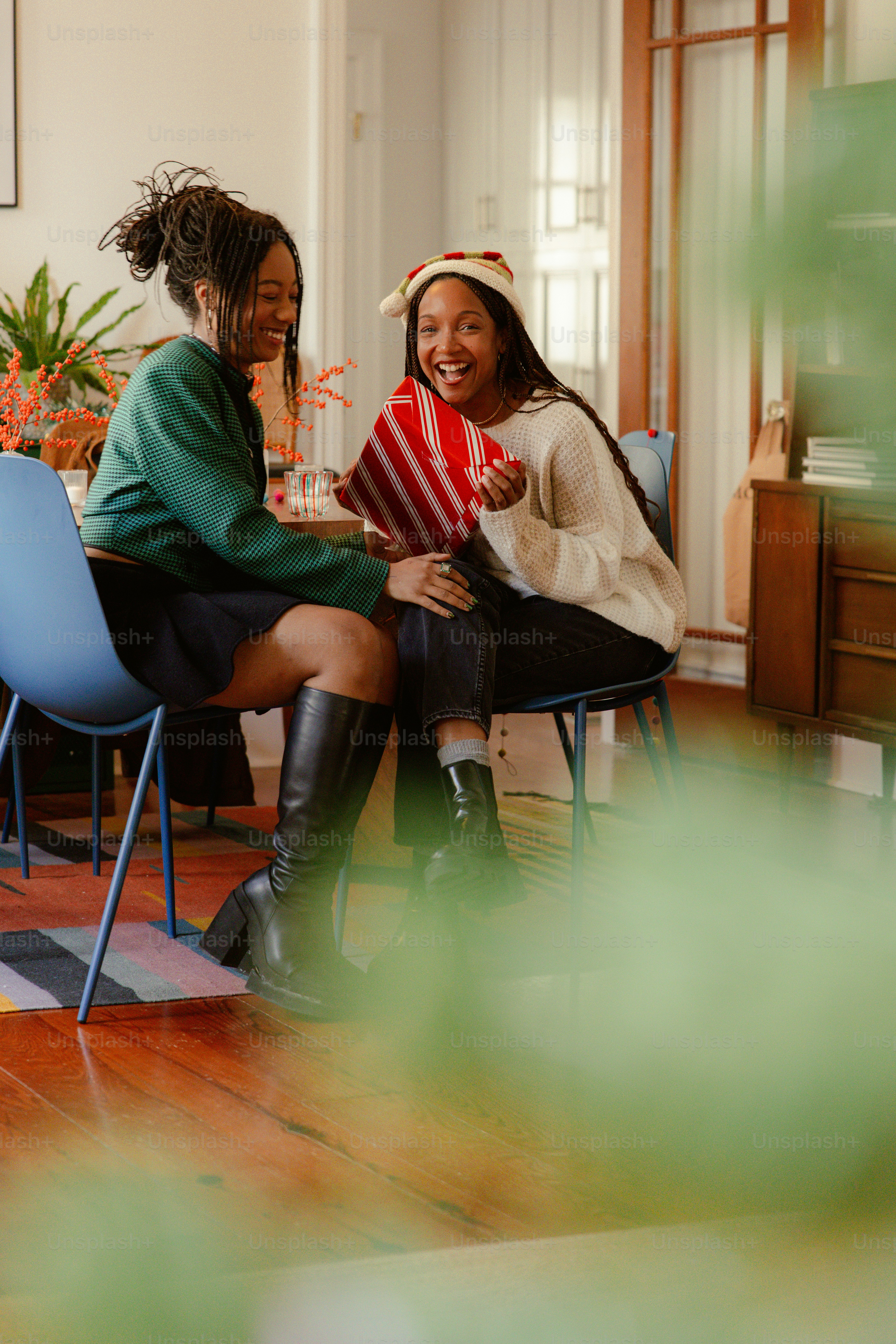 a couple of women sitting next to each other