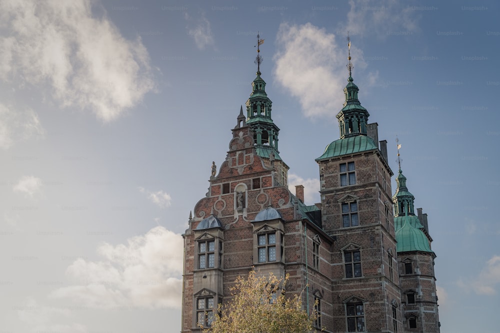 a large building with two towers and a clock