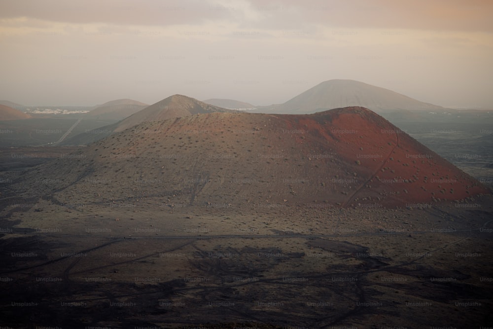 a hill with a few hills in the background