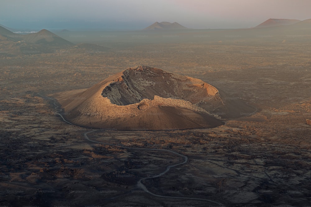 an aerial view of a desert with a river running through it