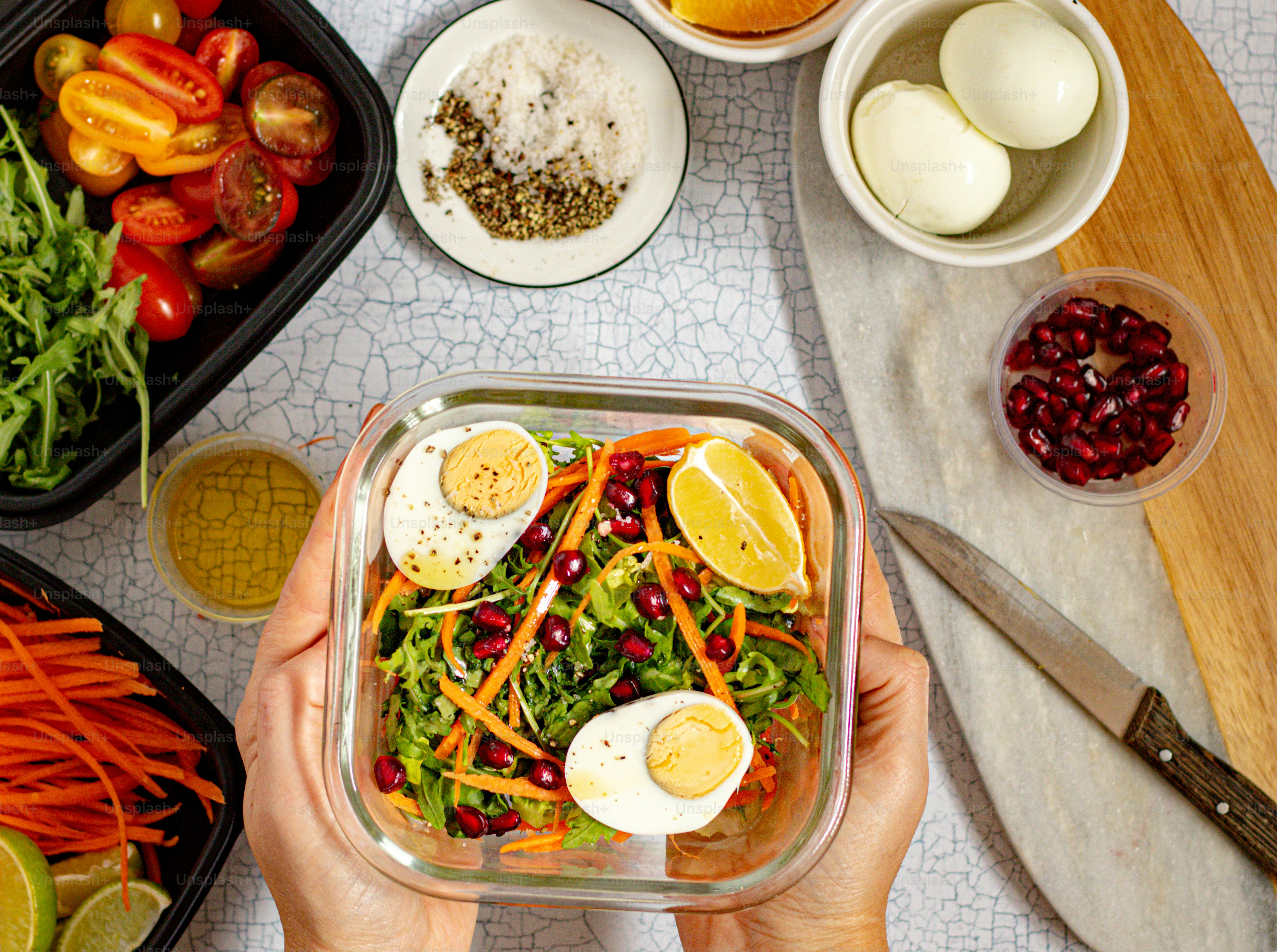 A person holding a plastic container filled with food photo – Healthy ...