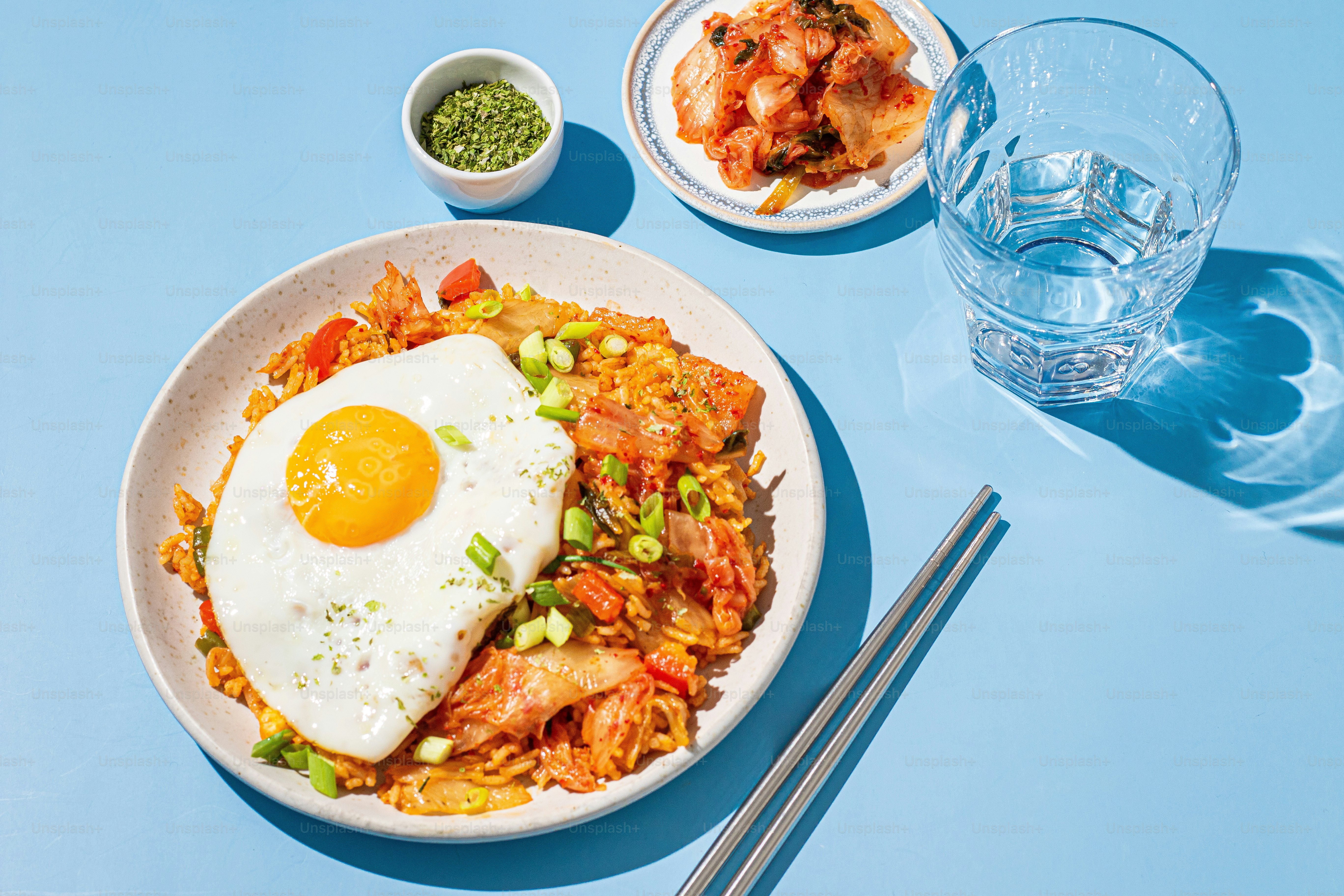 a plate of food with a fried egg on top