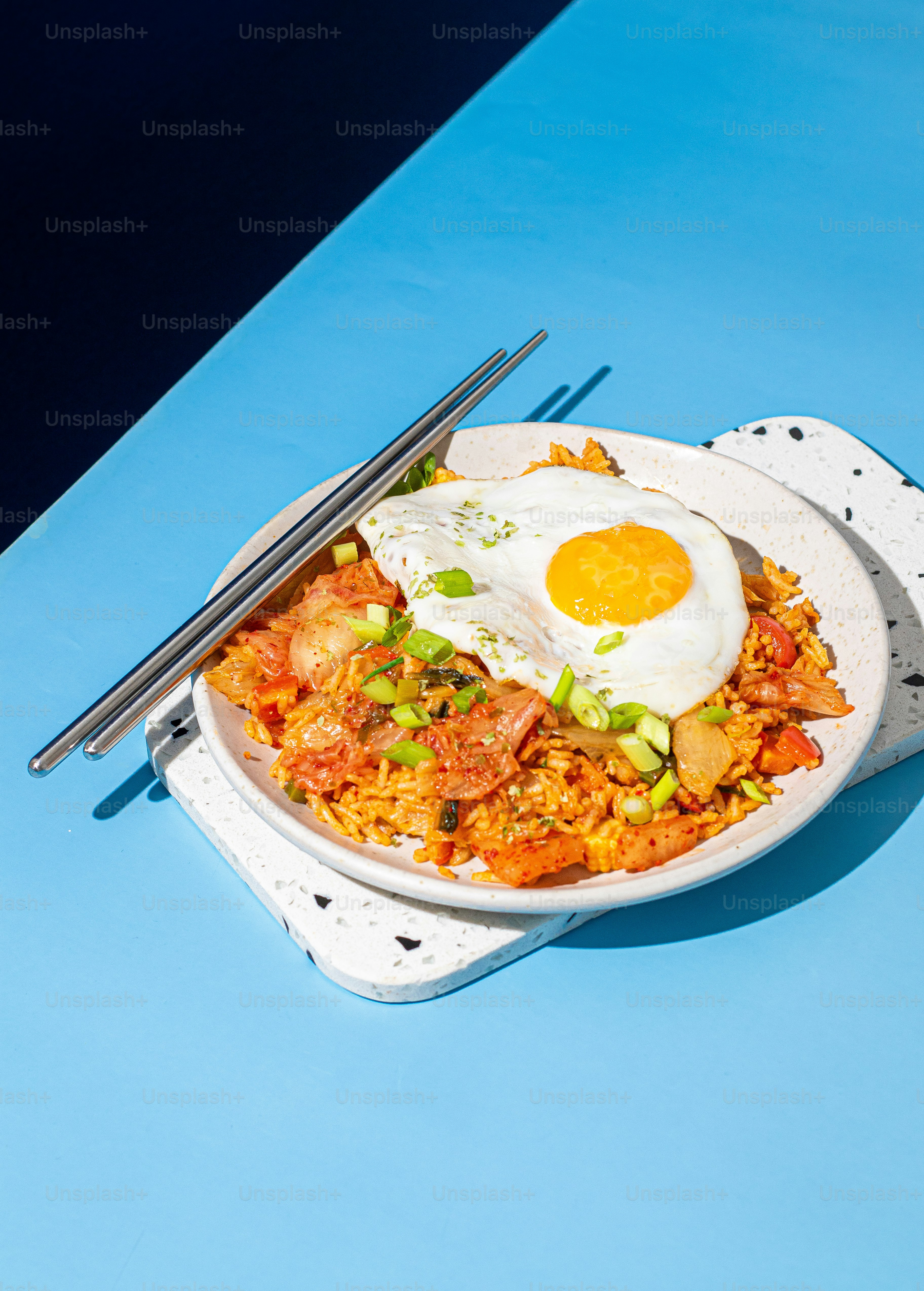 a plate of food with a fried egg on top