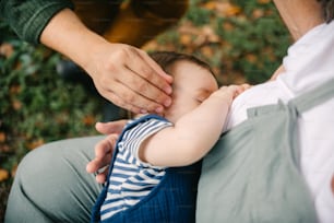 a man holding a baby in his lap