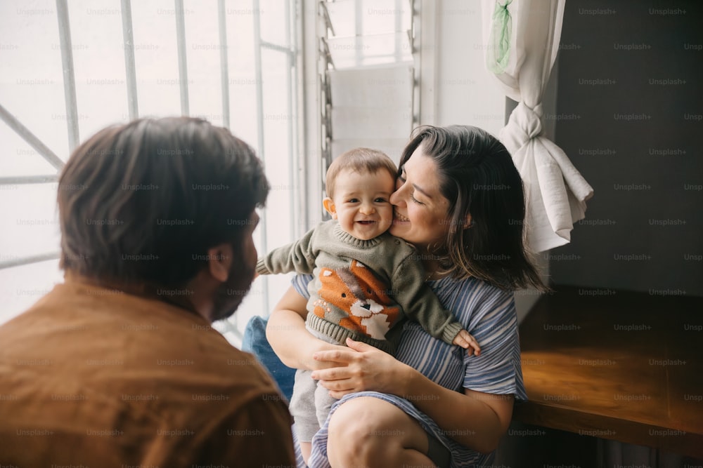 a woman holding a baby in her arms