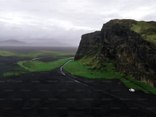 an aerial view of a black and green landscape