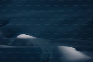 a dark photo of a snow covered mountain