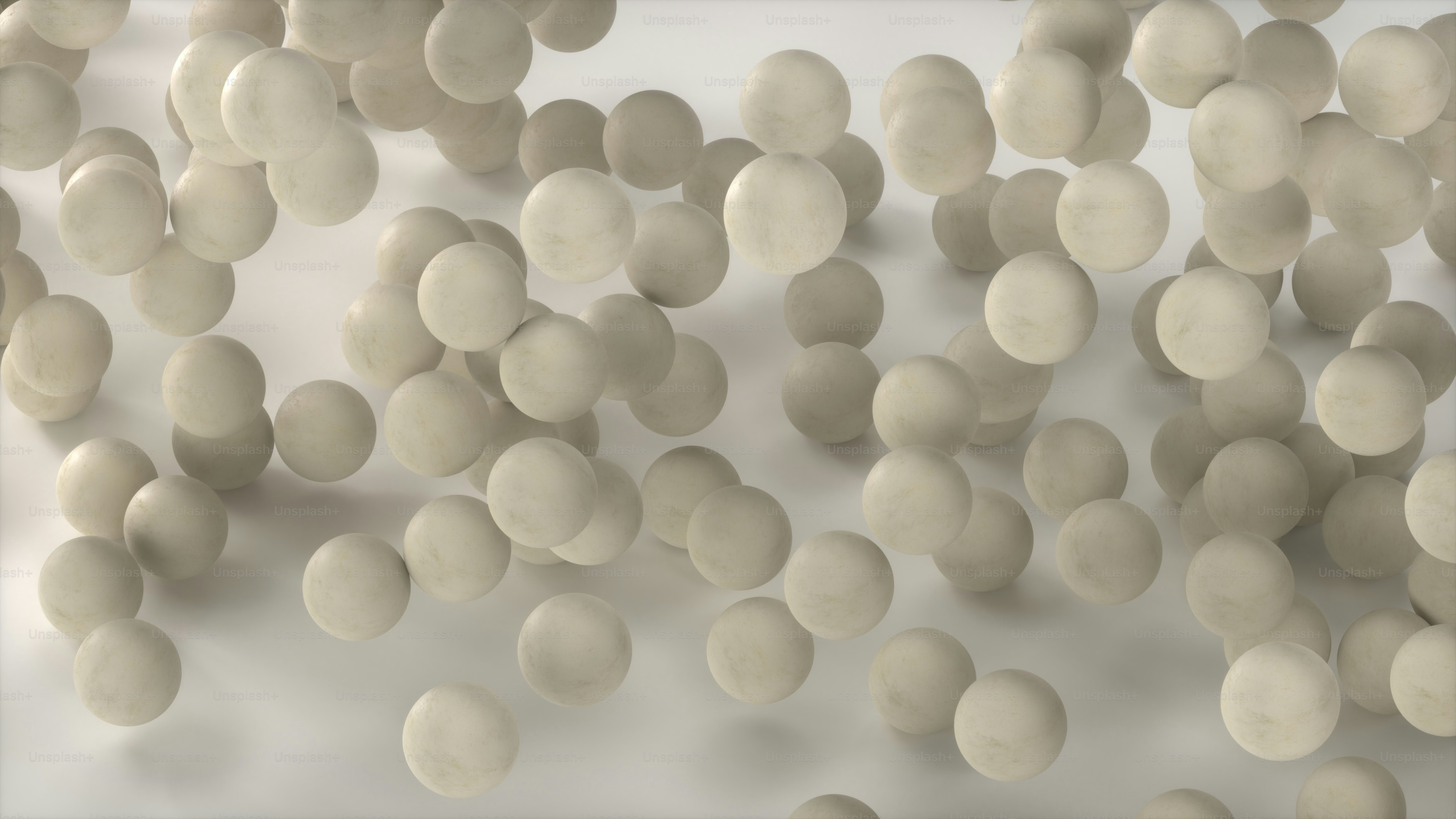 A group of white balls floating in the air photo – Background Image on ...
