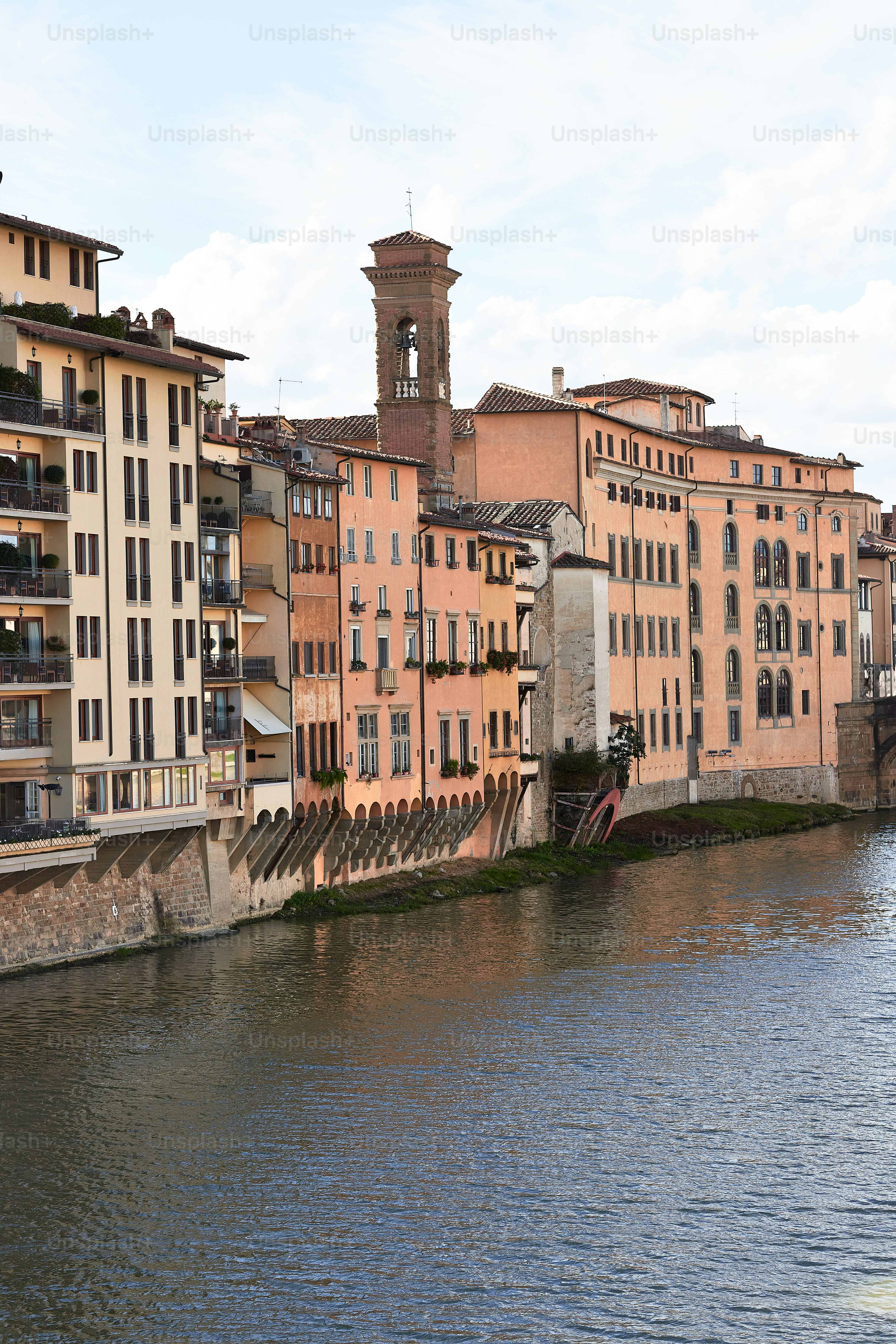 a river running through a city next to tall buildings