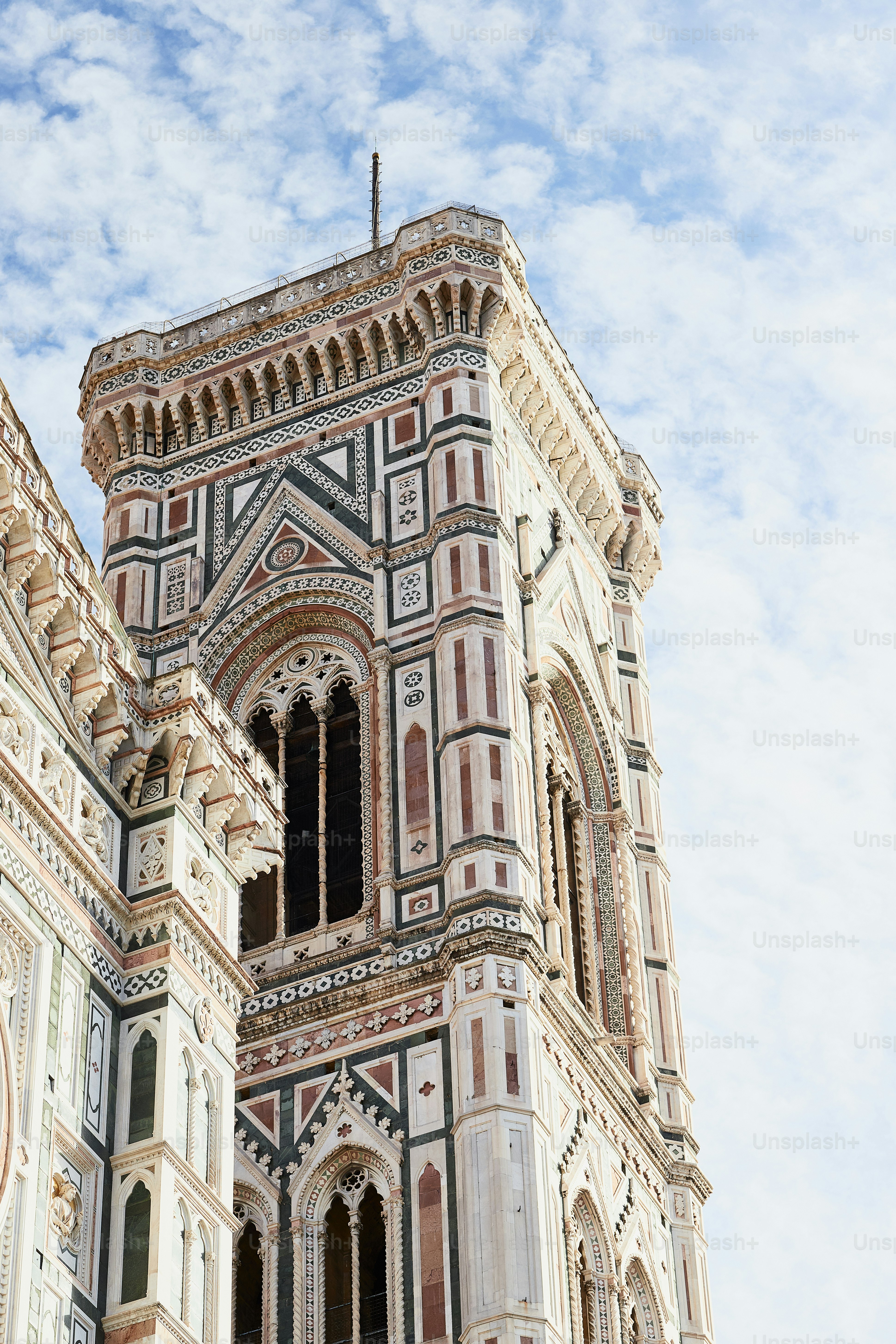 a very tall building with a clock on it's side