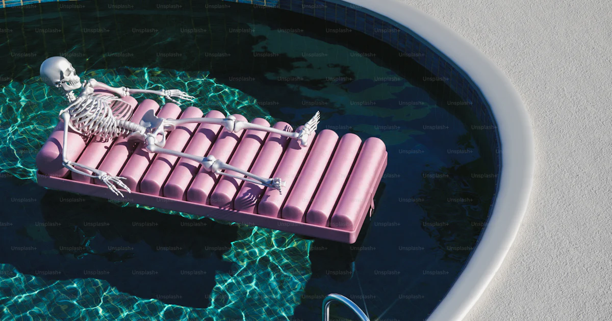 A pink inflatable raft floating on top of a pool photo – Swimming pool ...