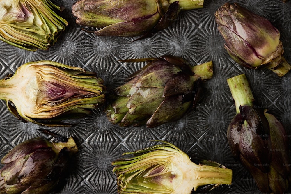 a bunch of artichokes sitting on top of a table