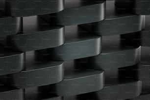 a close up of a wall made of black bricks