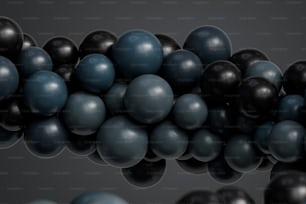 a bunch of black and blue balls on a gray background