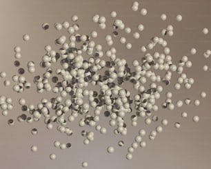 a bunch of white balls floating in the air