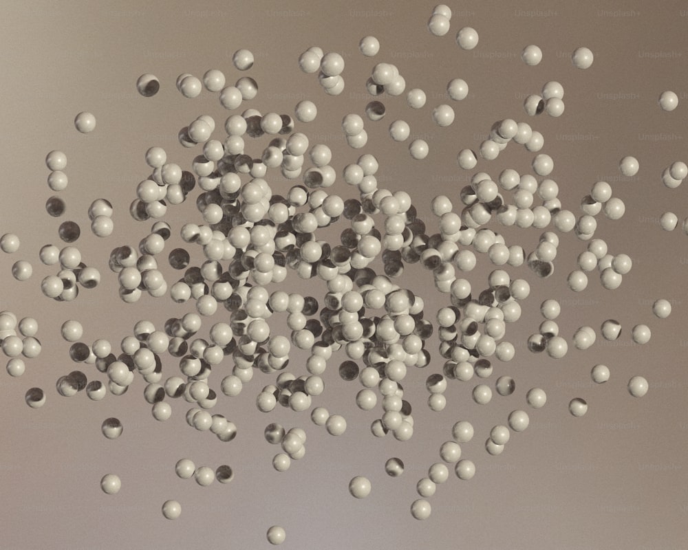 un montón de bolas blancas flotando en el aire