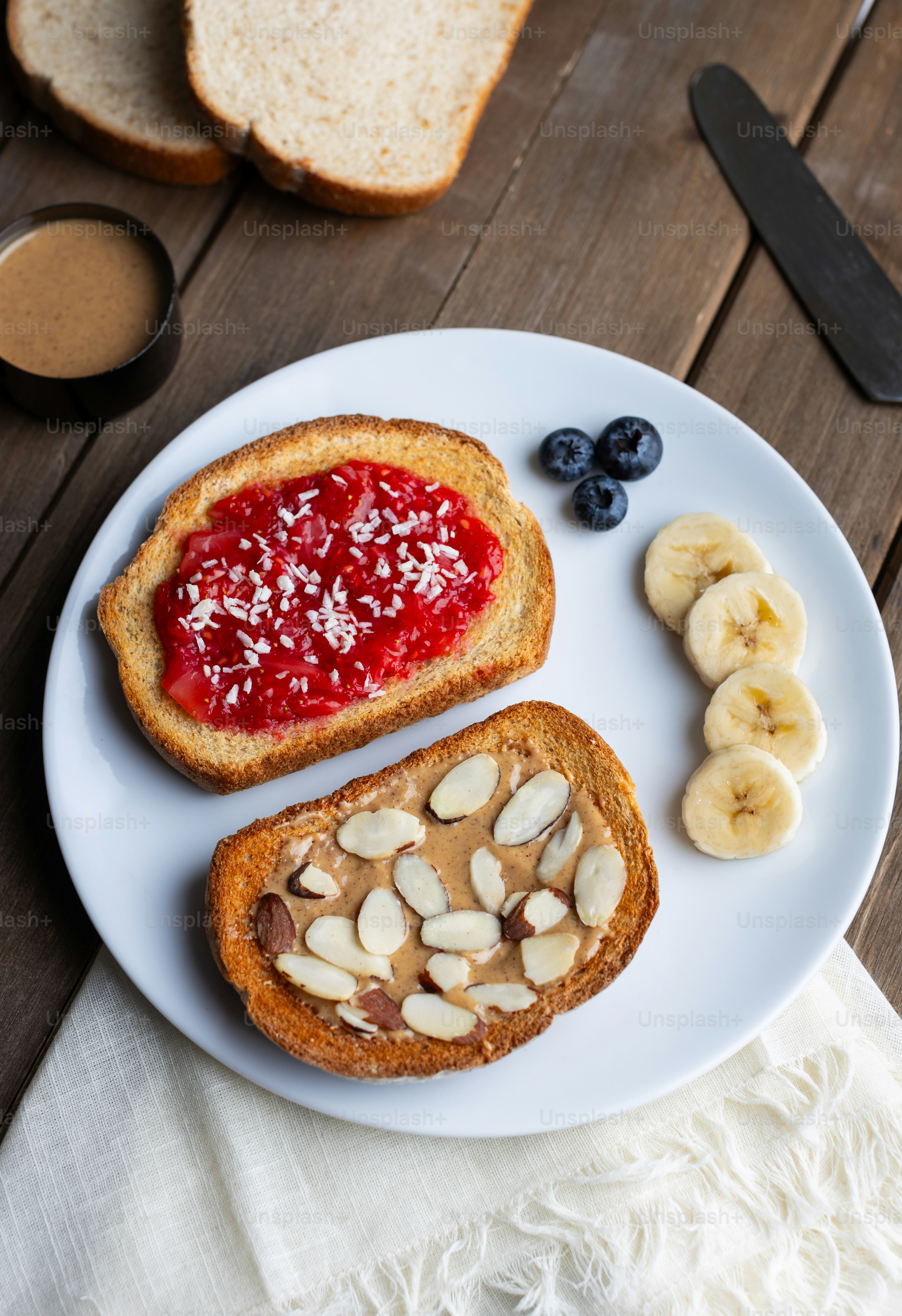 a white plate topped with toast and fruit