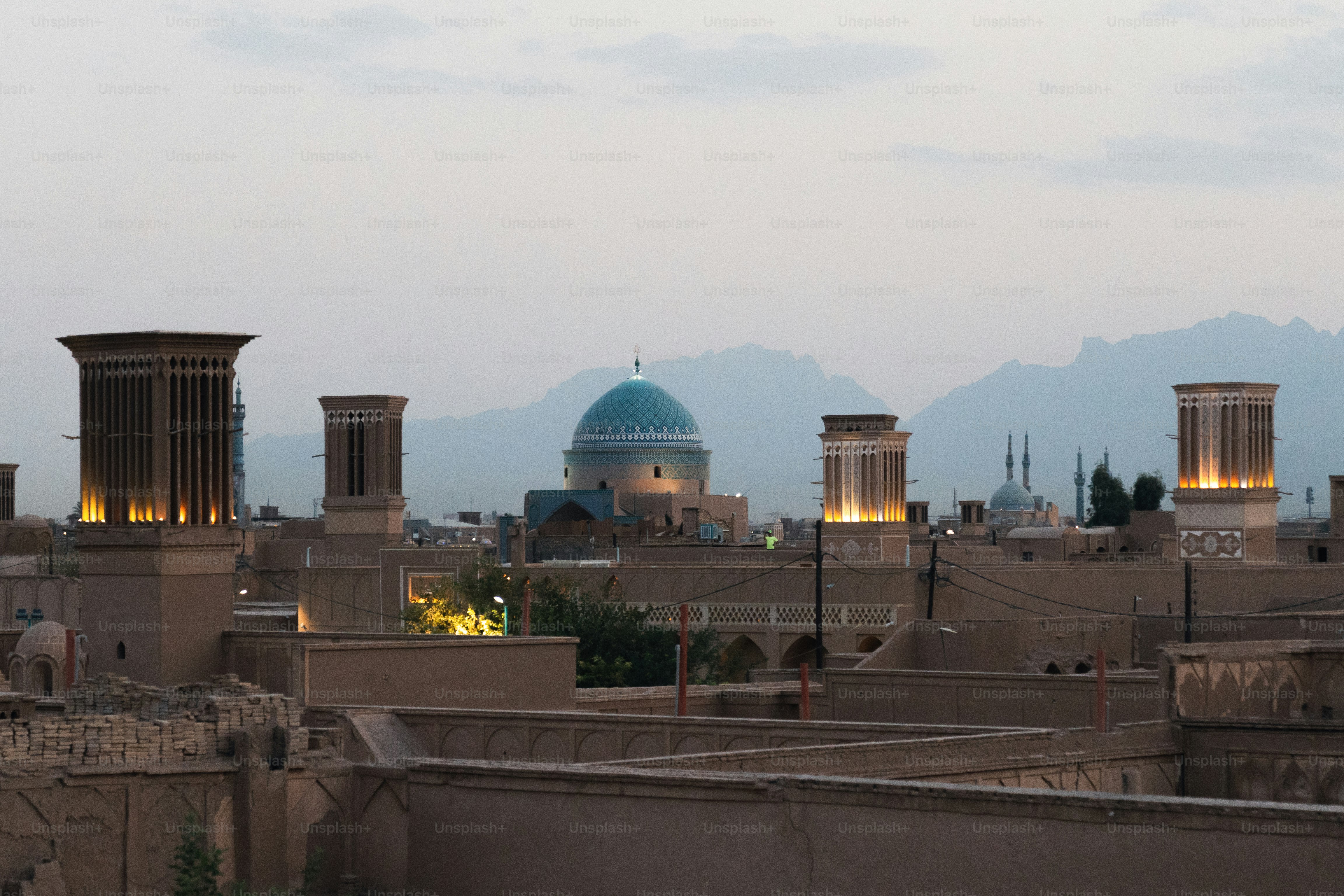 a view of a city with mountains in the background