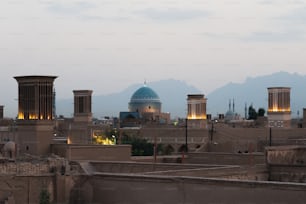 a view of a city with mountains in the background