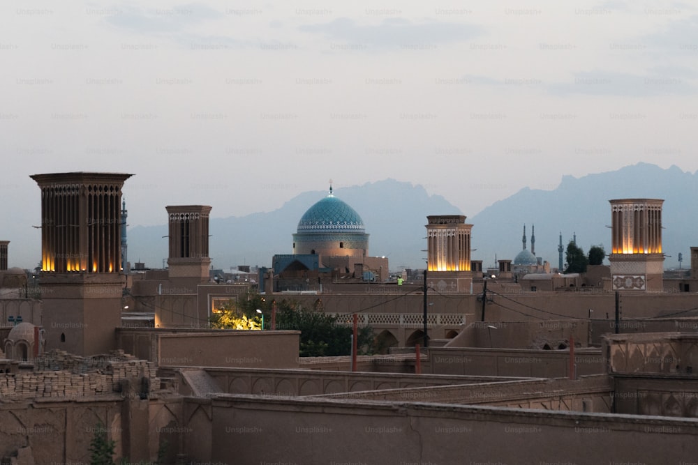 a view of a city with mountains in the background