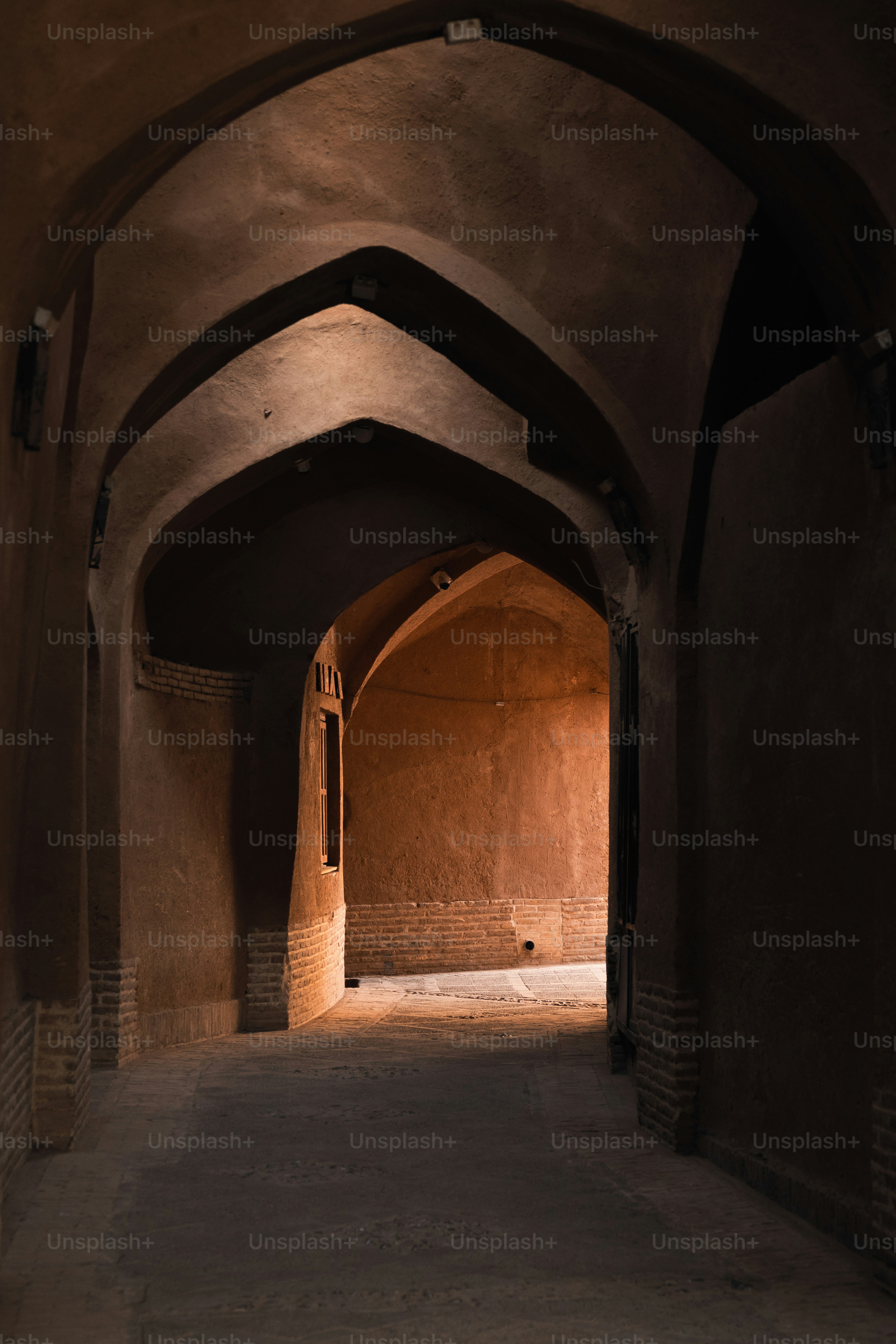 a tunnel with a clock on the side of it