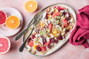 a plate of food with fruit and a fork