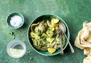 a bowl of food on a green table