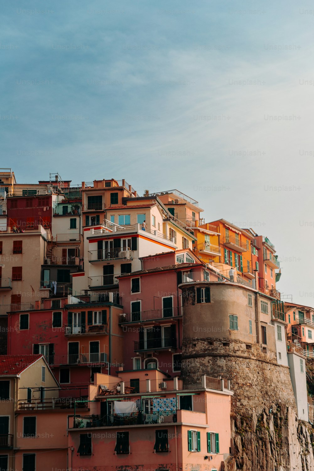 a very tall building with lots of balconies on top of it