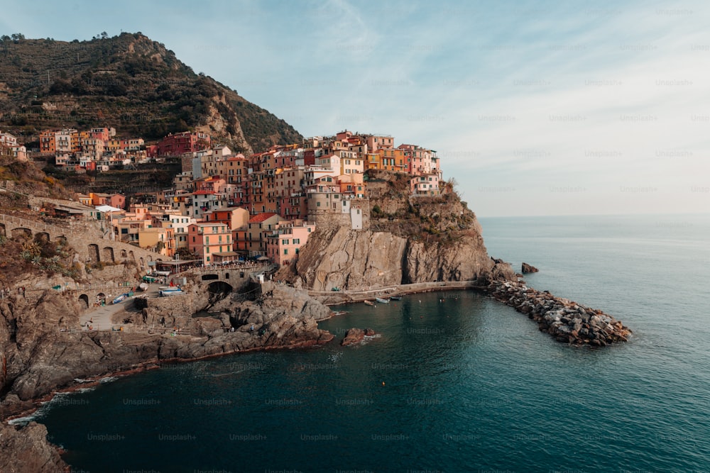 a small village on a cliff above the ocean