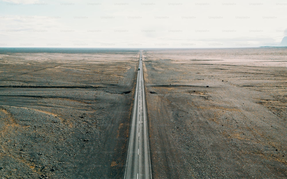 an aerial view of a highway in the middle of nowhere