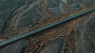 an aerial view of a road in the desert