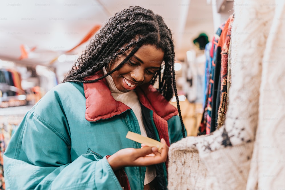 a woman looking at a piece of paper in a store