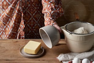 a person pours butter into a bowl