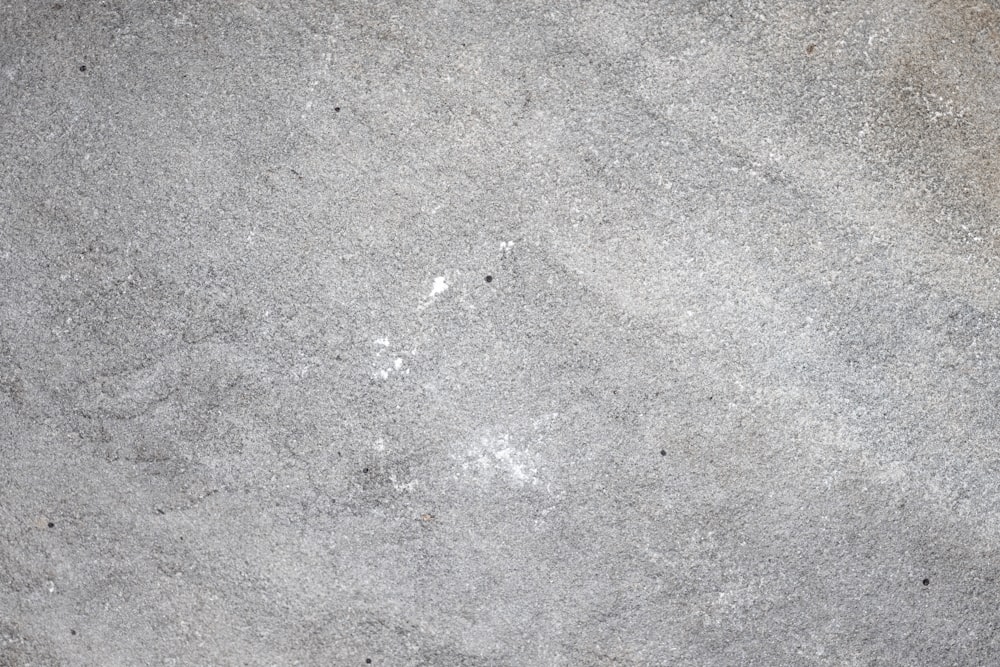 a close up of a gray concrete surface
