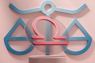 a pink and blue sign on a pink wall