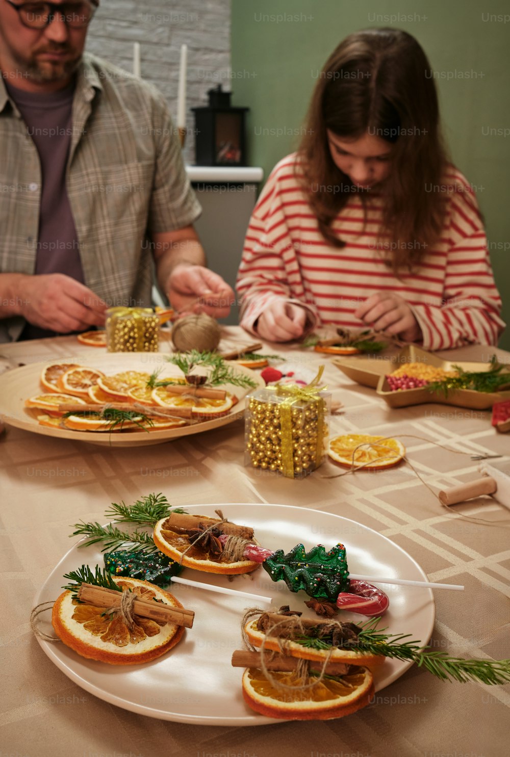 a couple of people sitting at a table with plates of food