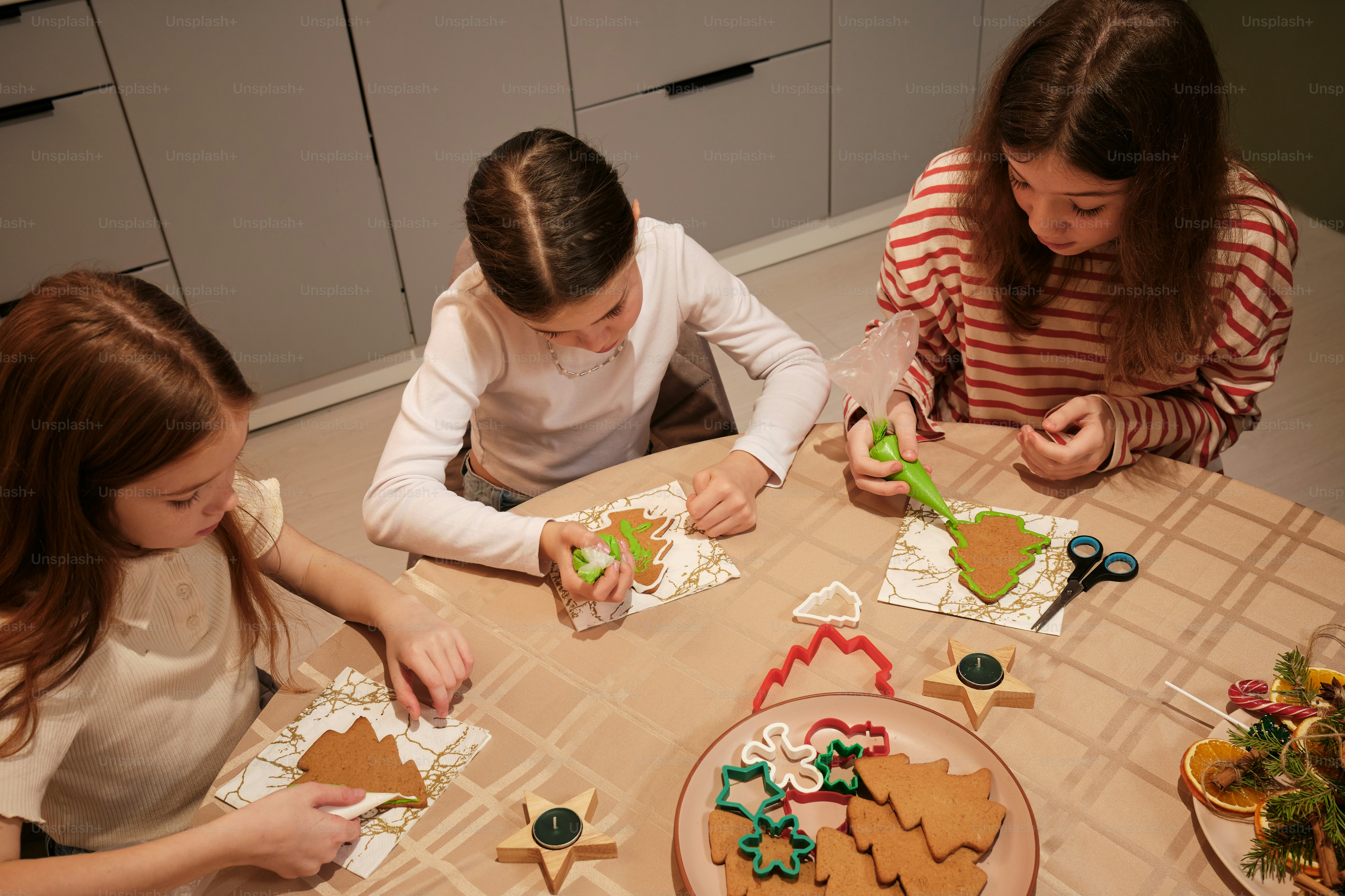 children make gingerbread trees at Christmas time