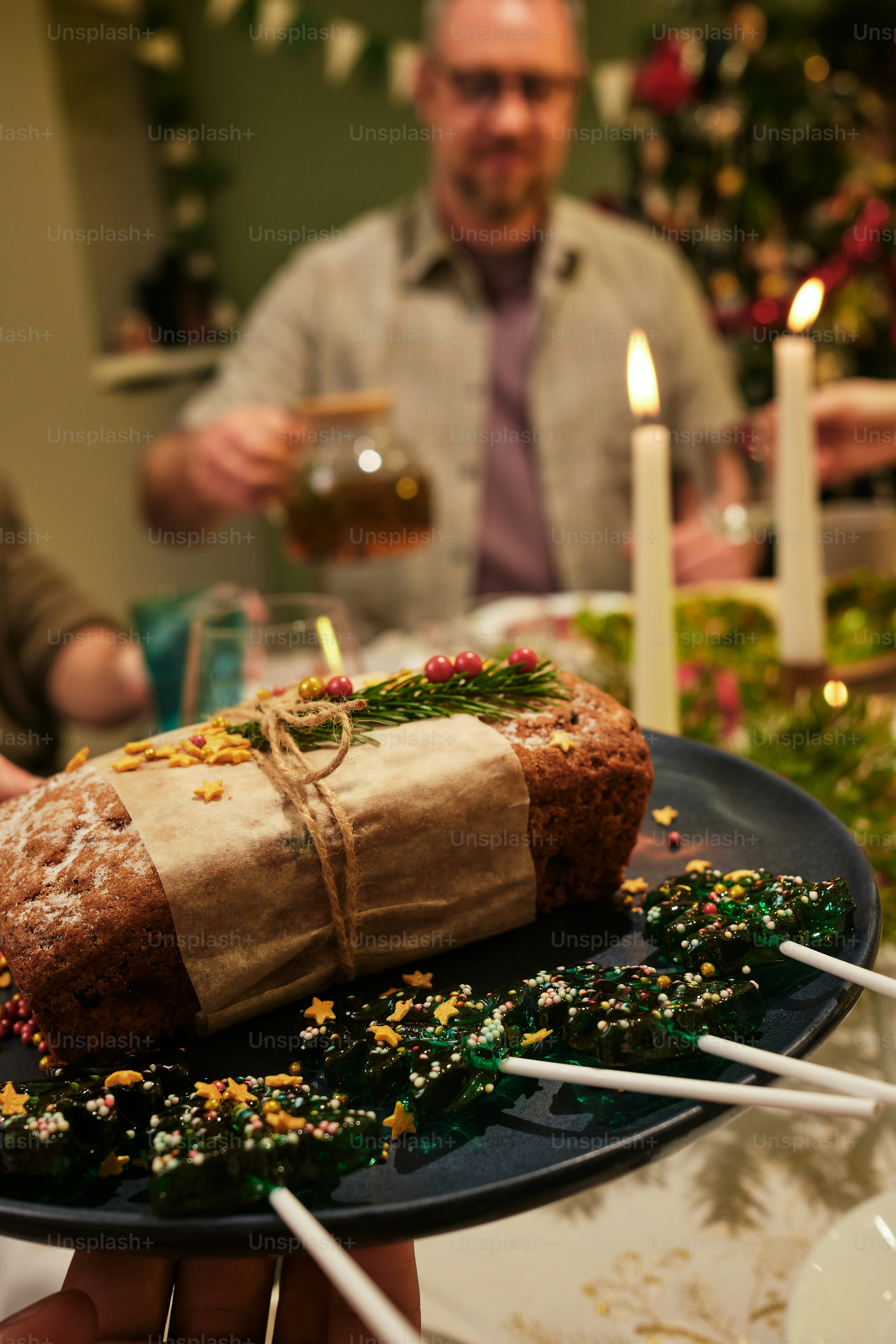 a person holding a plate with a cake on it