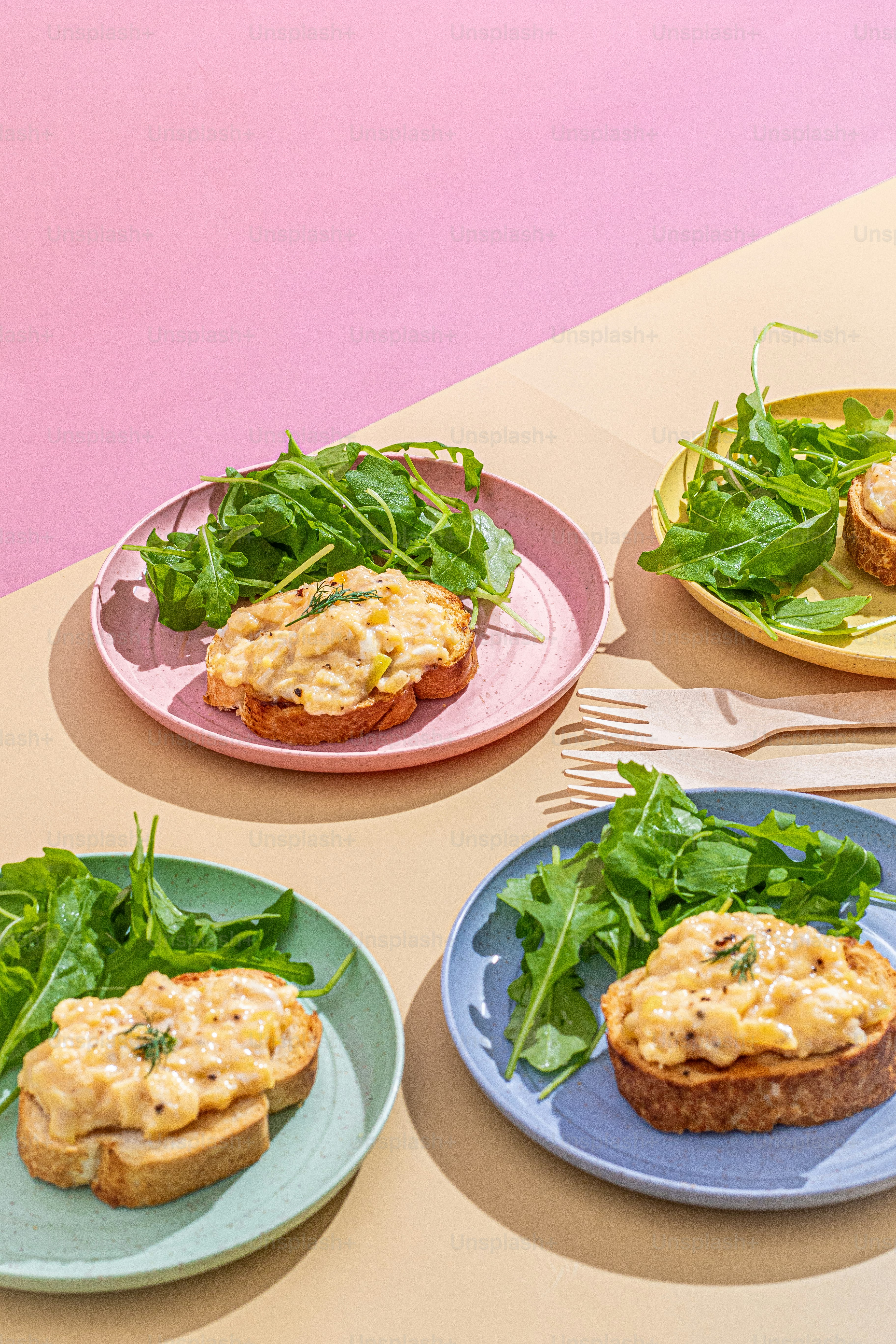 a table topped with three plates of food